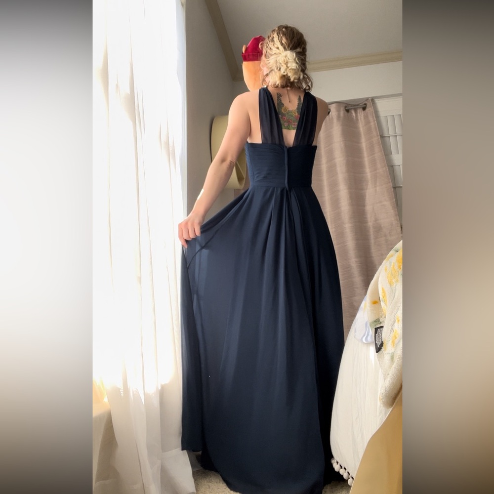 An elegant, navy blue gown
